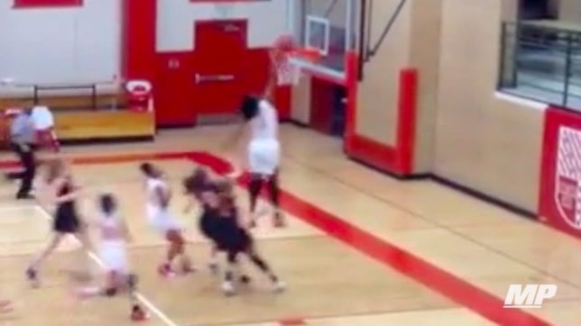 Francesca Belibi of Regis Jesuit (Aurora, CO) became the first female ever to successfully dunk a basketball in a game. Courtesy: @RJHSGDBball
