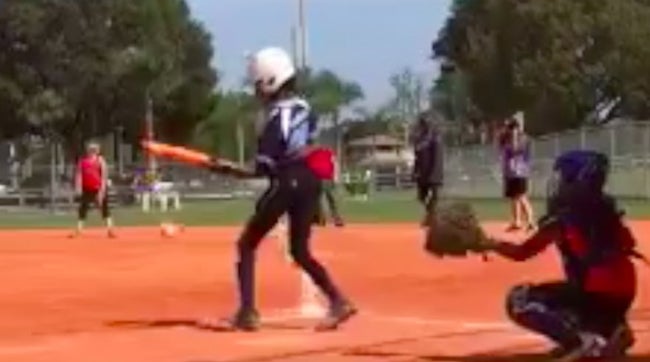 10-year-old Amani Stanley of Boca Impact (FL) does something you may have never seen before: a behind-the-back drag bunt for a base hit.