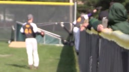 Outfielder climbs the wall to make catch