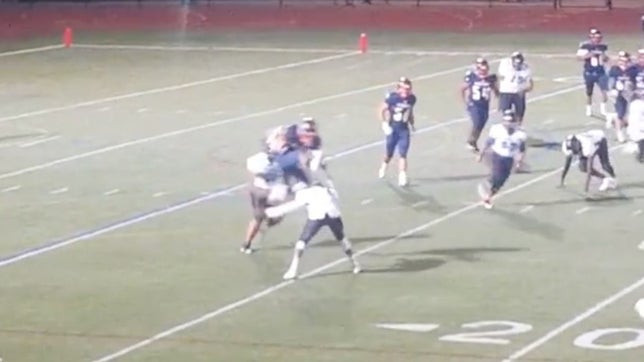 Steffan Gravely of Lynn Vo-Tech (MA) performs a sweet hurdle and drops two more defenders to complete the 91-yard touchdown run.