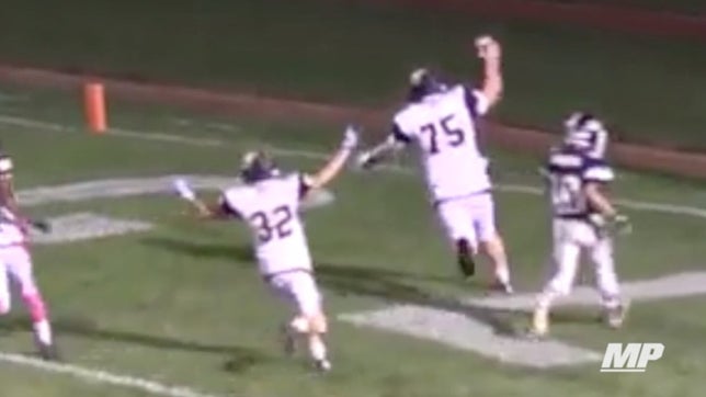 Spencer Quinn of Wayne (NY), a 305-pound defensive lineman, makes the tackle, strips the ball, and takes the fumble to all the way to the end zone.