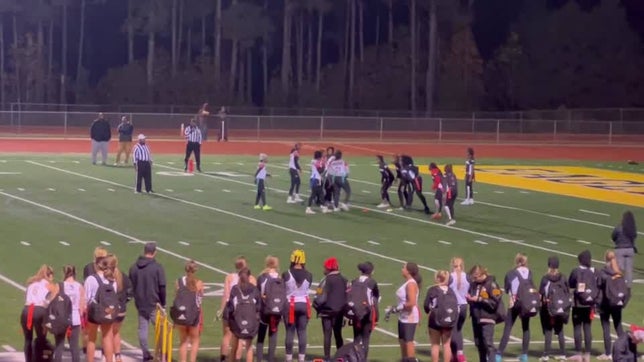 Taryn Kelley #11 grabs the flag and deny the game winning play . 
Dutchtown Wins