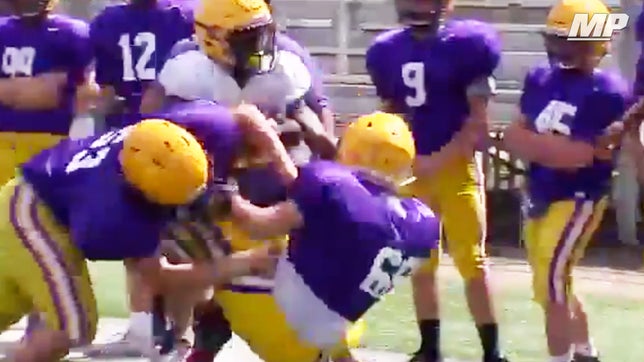 Denham Springs (LA) 5-foot-6 running back Tyre Golmond trucks a would be defender during spring practice.

Courtesy - Brandon Saho & WBRZ