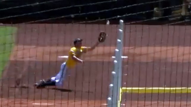 Tyler Pettigrew sells out with no remorse on this high foul ball deep into the bullpen area during Henley's 3-2 victory in the Oregon 4A State Championship game.