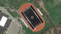 HS football team plays on black turf