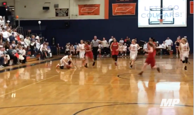 Emily Beard of Dickson County (TN) falls to the floor, keeps her dribble and still crosses a defender up. She finishes the play with a slick assist.