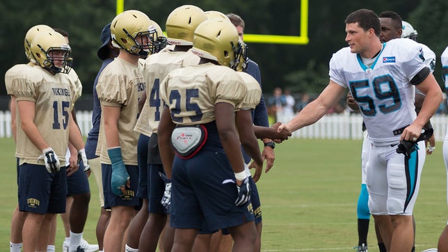 View images of Spartanburg High School (S.C.) football team working out with NFC champion Carolina Panthers at Wofford College in South Carolina.