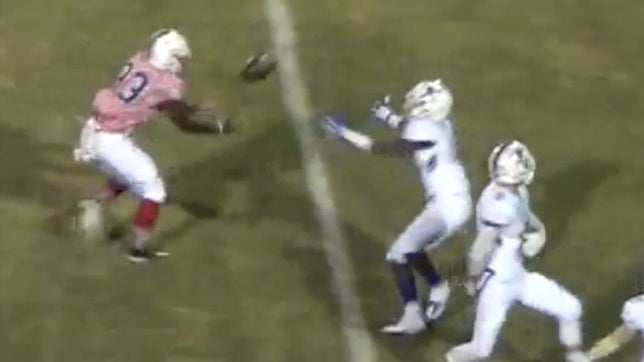 The ball goes off defenders head and hand into Koko Richey's arms.  66-yards later and Koko has a TD in the stat books.