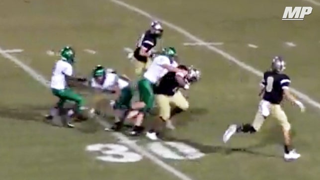 Dresden's (TN) Dylan Yates runs through two defenders for the 63-yard touchdown.