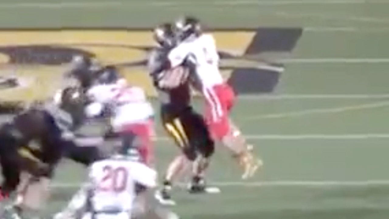 Lineman picks up defender & holds him in mid-air