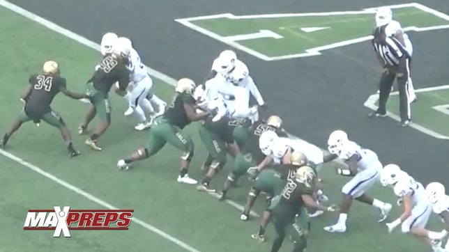 IMG Academy's (FL) four-star wide receiver Drake Davis shows off his athleticism leaping over DeSoto's offensive line and blocking the PAT and taking it back all the way for two.