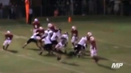 Defender Leaps Over Entire Team to Block Field Goal