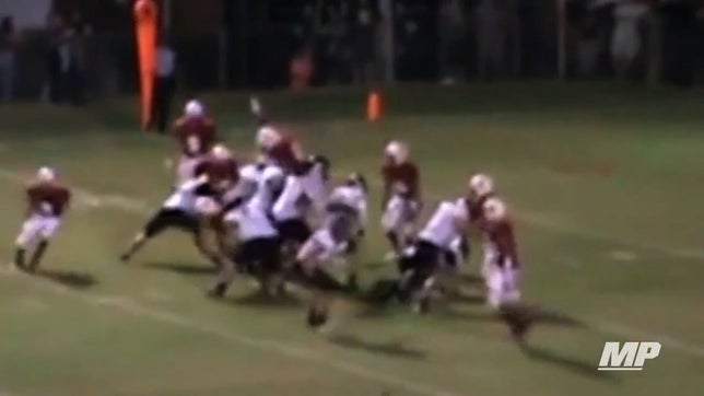 Tyler Blakely brings out his inner Troy Polamalu as he leaps the entire defensive and offensive lines to block a field goal attempt.