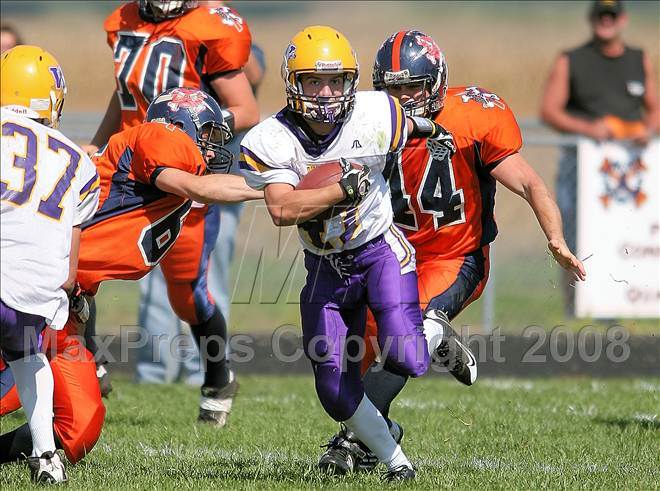 Williamsville's Earl Hollinshead (center) runs back a kickoff for a TD. New Berlin won 31-21.