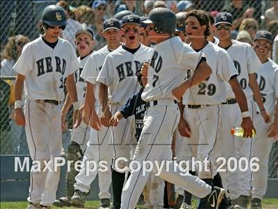 Elk Grove's Jaime Niley is greeted by teammates after hitting a homer