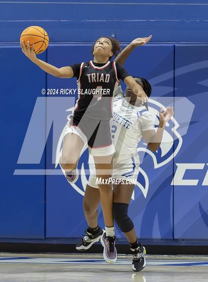 Thumbnail 1 in Triad vs Marquette Catholic (Columbia Tip Off Tournament) photogallery.