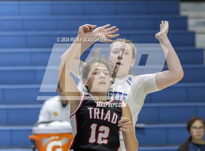 Thumbnail 1 in Triad vs Marquette Catholic (Columbia Tip Off Tournament) photogallery.
