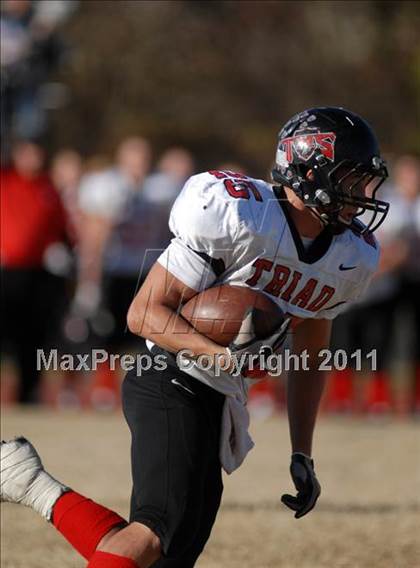 Thumbnail 2 in Triad @ Marion (IHSA Class 5A Playoffs - First Round) photogallery.