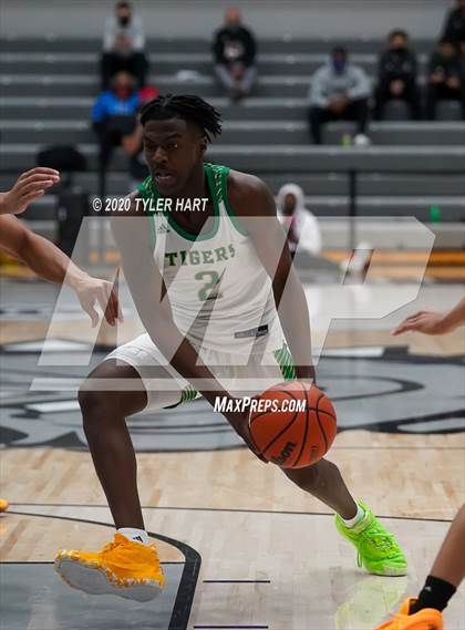 Thumbnail 1 in Indianapolis Crispus Attucks vs. Warren Central (Sneakers for Santa Shootout) photogallery.