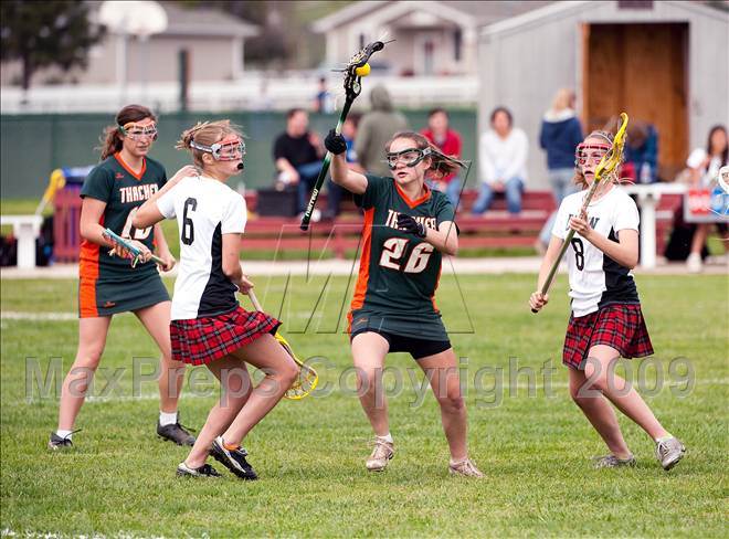 Thacher heading for a goal in a 12-10 win over Dunn.