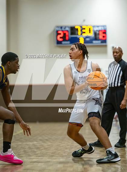 Thumbnail 2 in New Life Christian Academy vs. James Cardinal McGuigan (Veterans Showcase) photogallery.