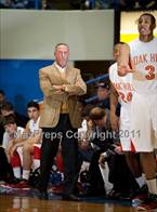 Legendary head coach Steve Smith looks on.