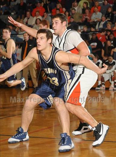 Althoff's Sonnenberg wards off Jacob Alvis trying to get a pass down low.