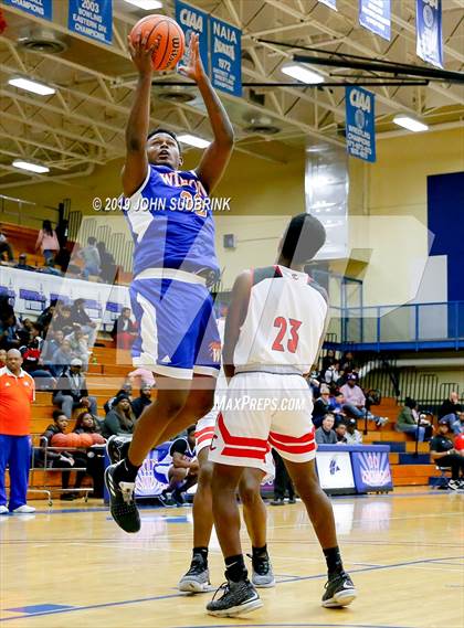 Thumbnail 3 in Currituck County vs Woodrow Wilson (Robert L. Vaughan Border Clash Basketball Invitational) photogallery.