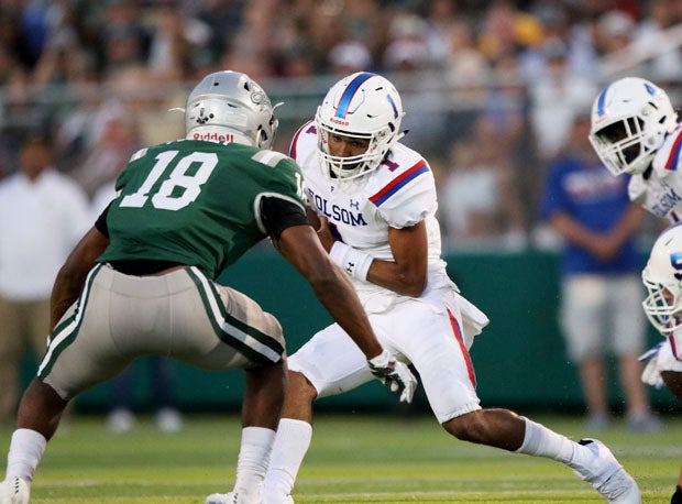Isaiah Foskey (18) hems in Folsom quarterback Kaiden Bennett.