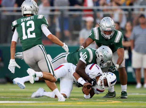 De La Salle linebacker Jhasi Wilson delivers one of seven sacks on Kaiden Bennett.