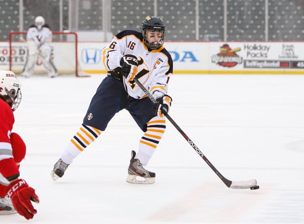 A Victor player makes a pass during his team's game against Canandaigua.