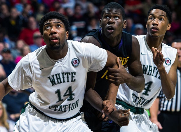 Chris Egi (center, in black jersey) and Montverde Academy knocked off White Station in the Bass Pro Shops Tournament of Champions final last month. Both teams still have eyes on a national title.