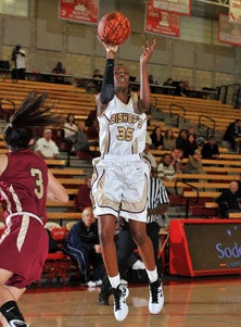Bishop's Imani Littlejon goes
up for two of her 15 points.