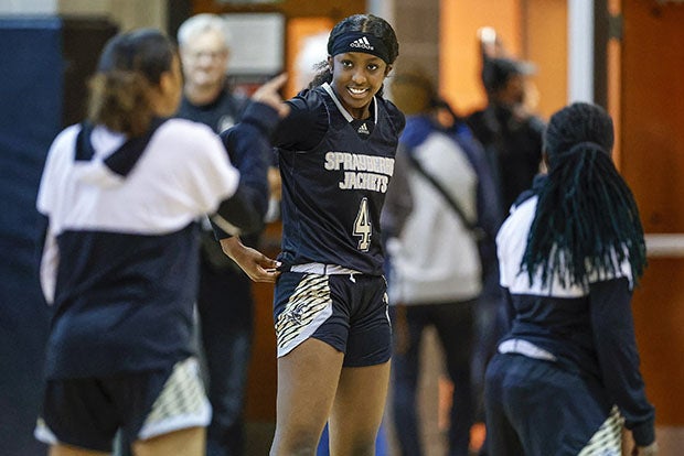 Flau'Jae Johnson warms up for a game in early February.