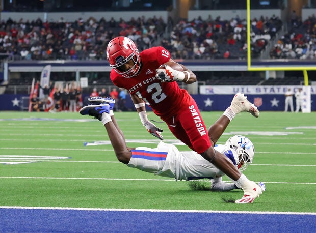 North Shore's Jhalyn Bailey dives into the end zone for the game's first touchdowns on a 3-yard reception. 