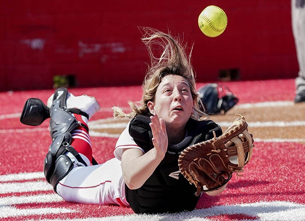 Glen Rose (Texas) catcher Belle McDonald dives for a foul ball against Midlothian Heritage.
