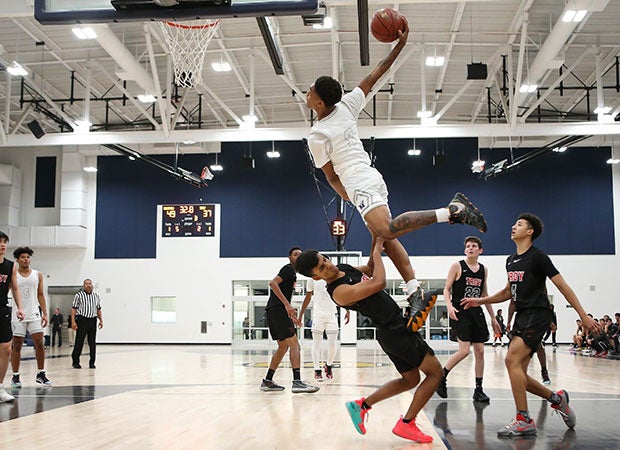 Guard Dior Johnson of Mayfield (Calif.) soars in for a dunk attempt against Troy in the North Orange County Championships.