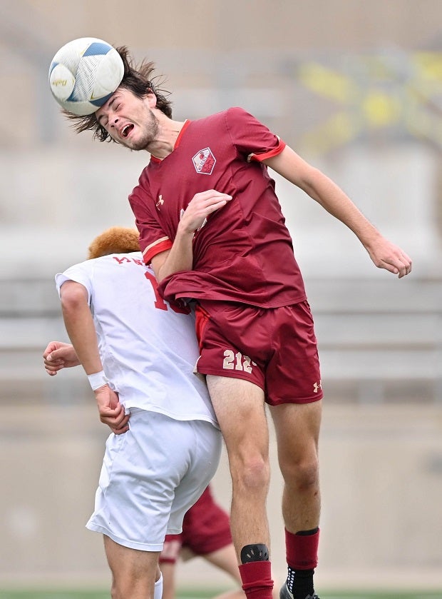 Hayden Richards of Cypress Woods wins a header in the UIL 6A Regional Final against Duncanville. Duncanville won the match to advance in the state playoffs. (Photo: Jo Ann Nowak)
