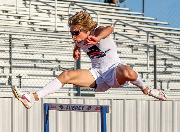 Aubrey's Ryan McMeen competes in the 300 hurdles in 4A UIL District meet. McMeen won the heat and advanced to the Area meet. (Photo: Freddie Beckwith)