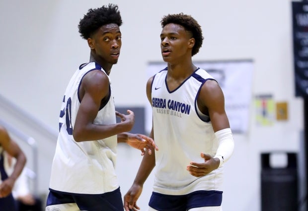 The sons of former Miami Heat teammates LeBron James and Dwyane Wade, Bronny James and Zaire Wade are pictured here during a preseason scrimmage against Rolling Hills Prep.