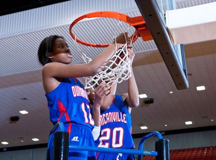 Ariel Atkins, left, and her Duncanville teammates jumped nine spots in the Xcellent 25 after knocking off MacArthur.