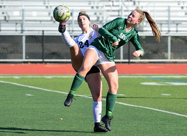 Lauren Zorovich (left) of California High battles Kaleigh Olla of San Ramon Valley for control of the ball.