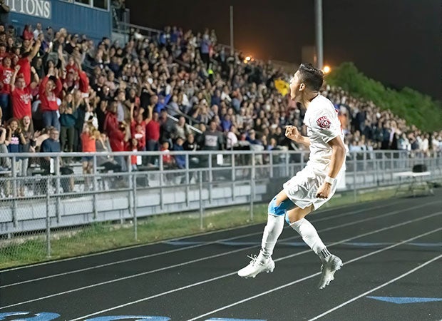 Wilmar Aguilar of Lee (Texas) celebrates his winning goal against Central Catholic in front of a packed home crowd.