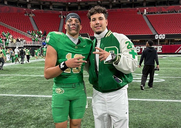 Buford quarterback Dayton Raiola celebrates the title game victory with older brother Dylan Raiola, who is currently a hot commodity in the college football transfer portal. (PHOTO: Jessica Phillips)