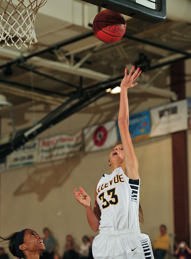 Bellevue's Shelby Cansler goes up with a left-hand layup of her own. 