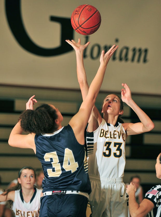 Bellevue's Shelby Cansler wins the opening tip against Abby Conklin. 
