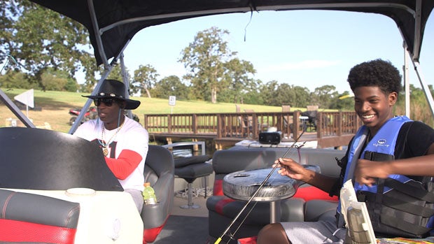 Deion Sanders and his freshman son Shedeur Sanders enjoy the afternoon fishing.