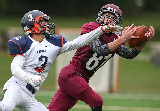 St. James (Md.) receiver Colin Williams makes a catch in front of a Potomac School defender.  