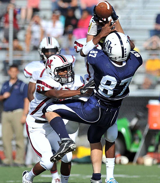 A Byram Hills (Armonk, N.Y.) player fights a Nyack (Upper Nyack, N.Y.) opponent for a catch.