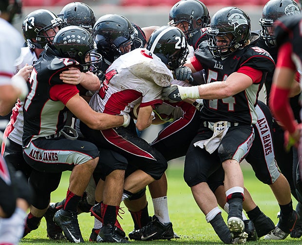 Alta (Sandy, Utah) tacklers swarm around an Allentown (N.J.) ballcarrier.